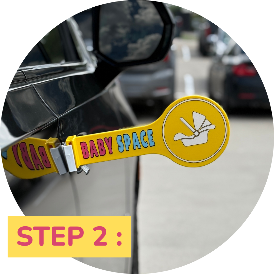 Step two: Baby Space sign shown after closing the door, bright, visible, and ready to protect space for loading a baby car seat or stroller.