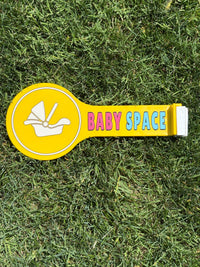 Bright yellow Baby Space car sign for parents and family.