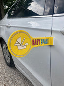 The Baby Space sign attached to a white car, a must-have for new parents who need safe space to load their baby.